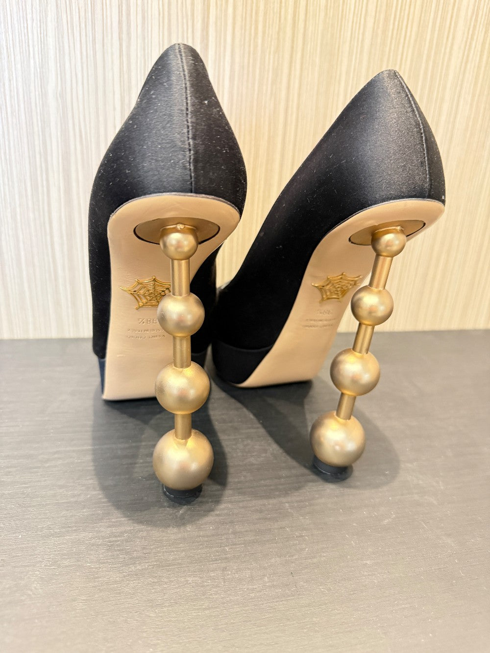 Charlotte Olympia Black Satin Platform Pumps with Signature Gold Ball Heel. Size EU 38.5|38